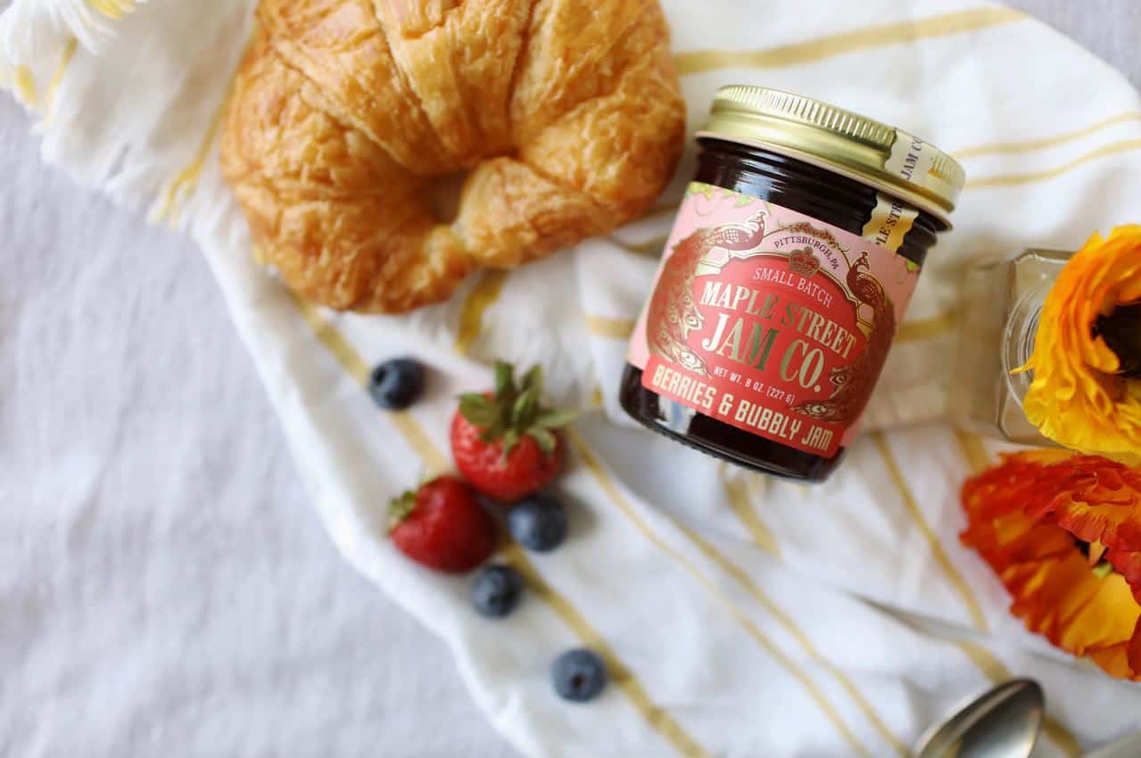 Maple Street Jam Co.'s Berries & Bubbly Jam paired with a croissant.