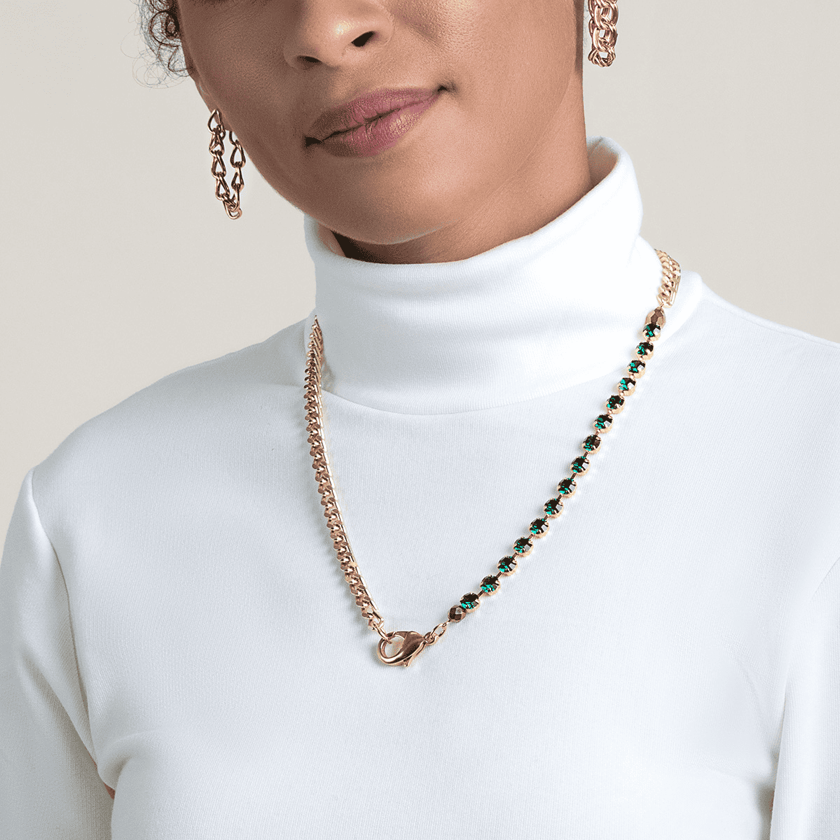 A photo of a model wearing Sabika jewelry, including the Gold Sabika London Modular Necklace.