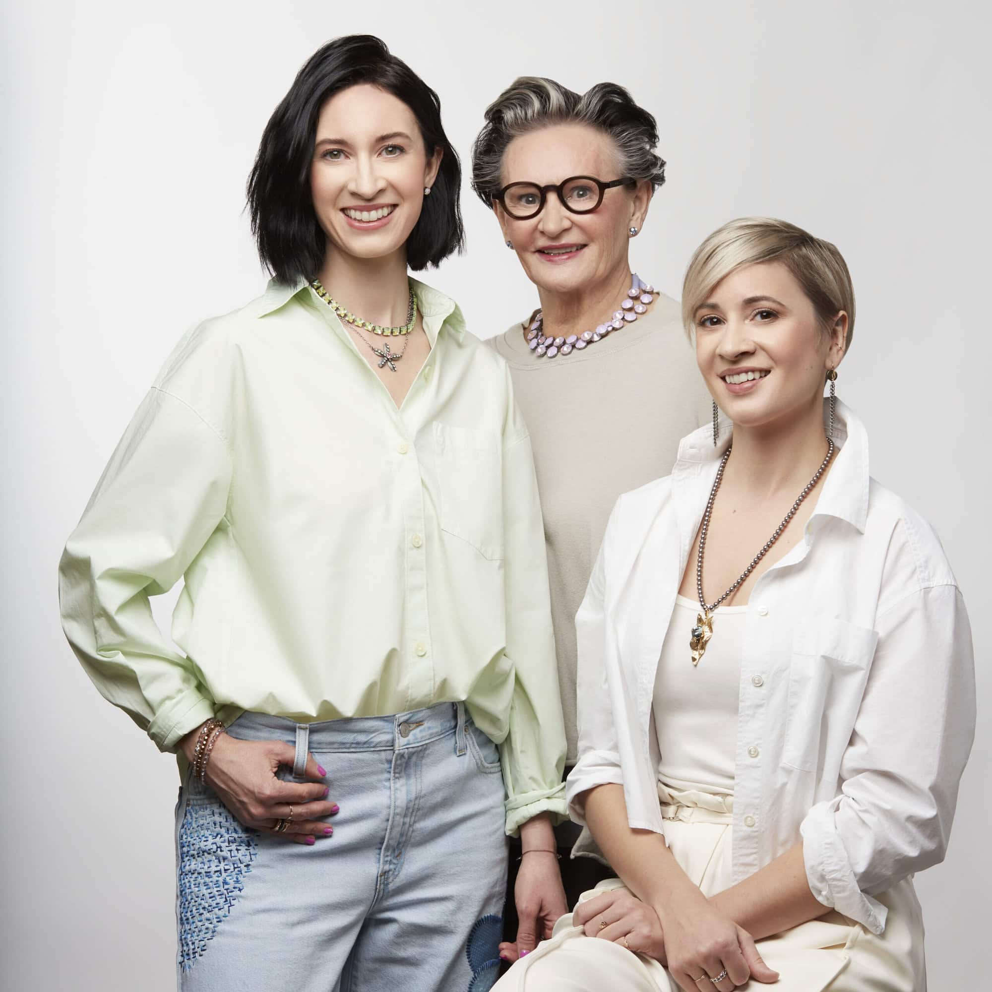 From right to left: Alexandra, Karin, and Miriam posing and wearing Sabika jewelry.