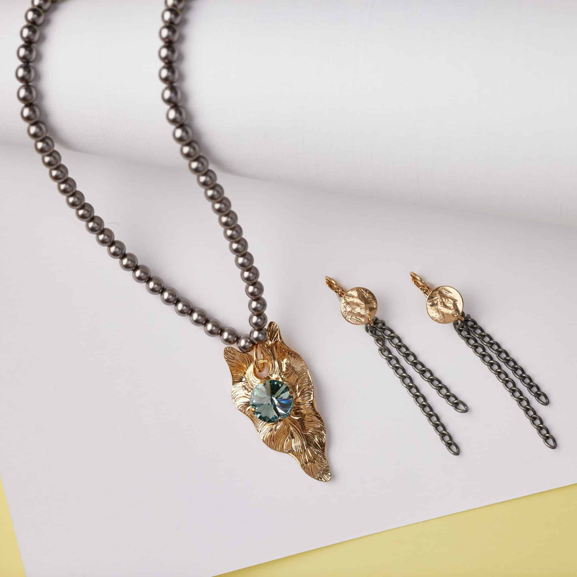 A photo with a white and yellow background featuring the "Desert Rider" jewelry within the Spring 2023 Collection.