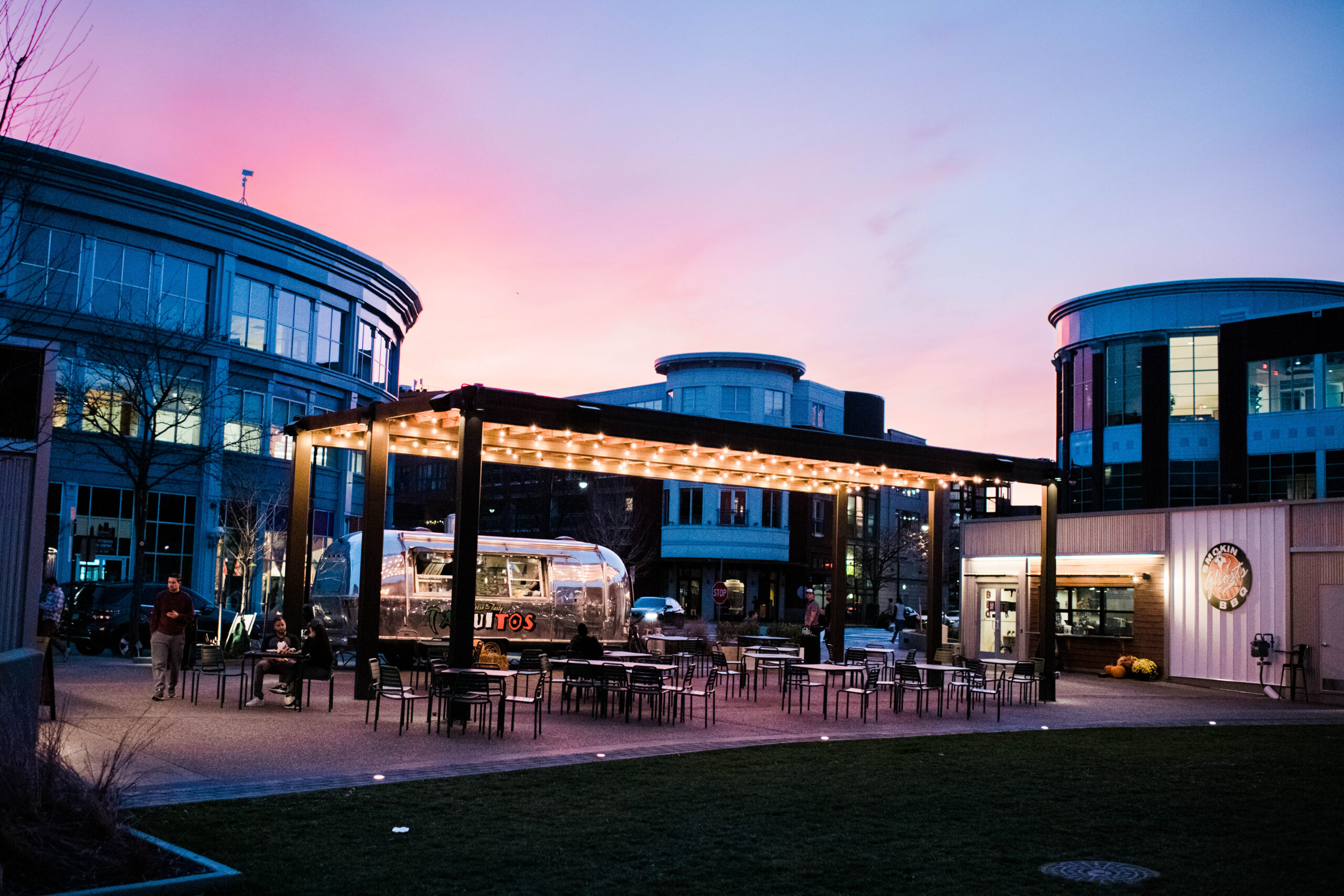 A photo at Sunset of outdoor dining at South Side Works.