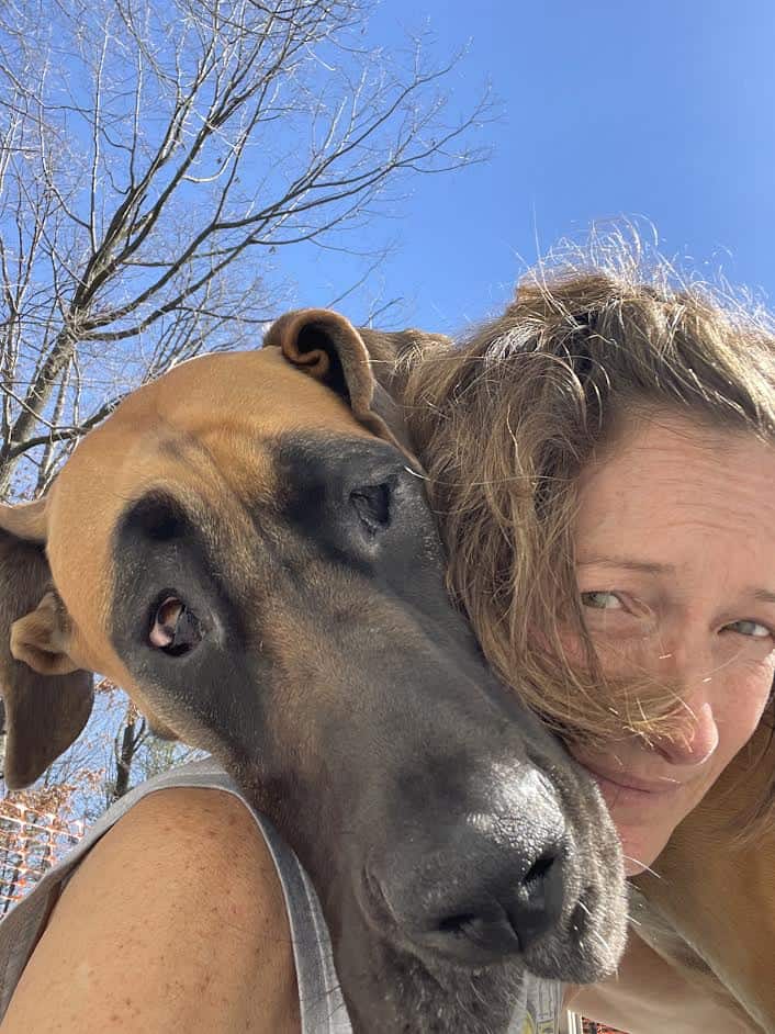 A photo of a woman with a large dog.