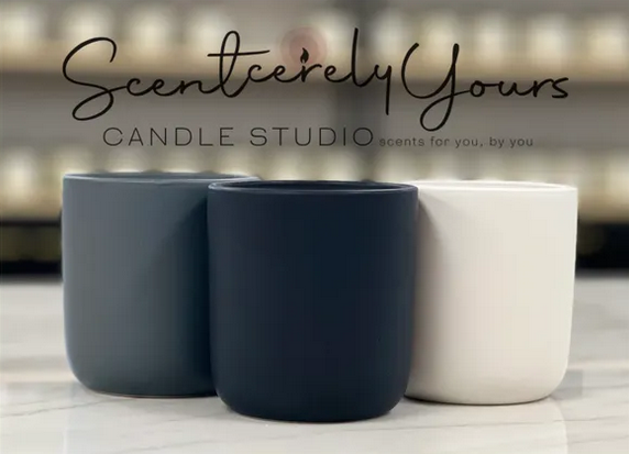 A photo of three candles with text on the image that reads: "Scentcerely Yours / Candle Studio / scents for you, by you."