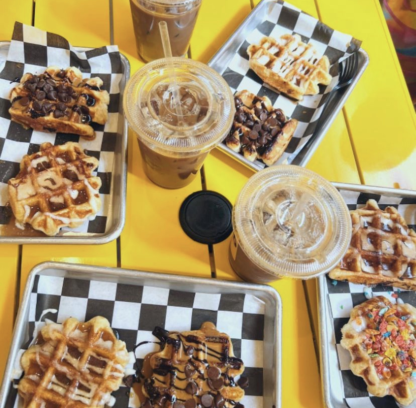 A photo of waffles with different toppings and a couple iced coffees from Smashed Waffles.