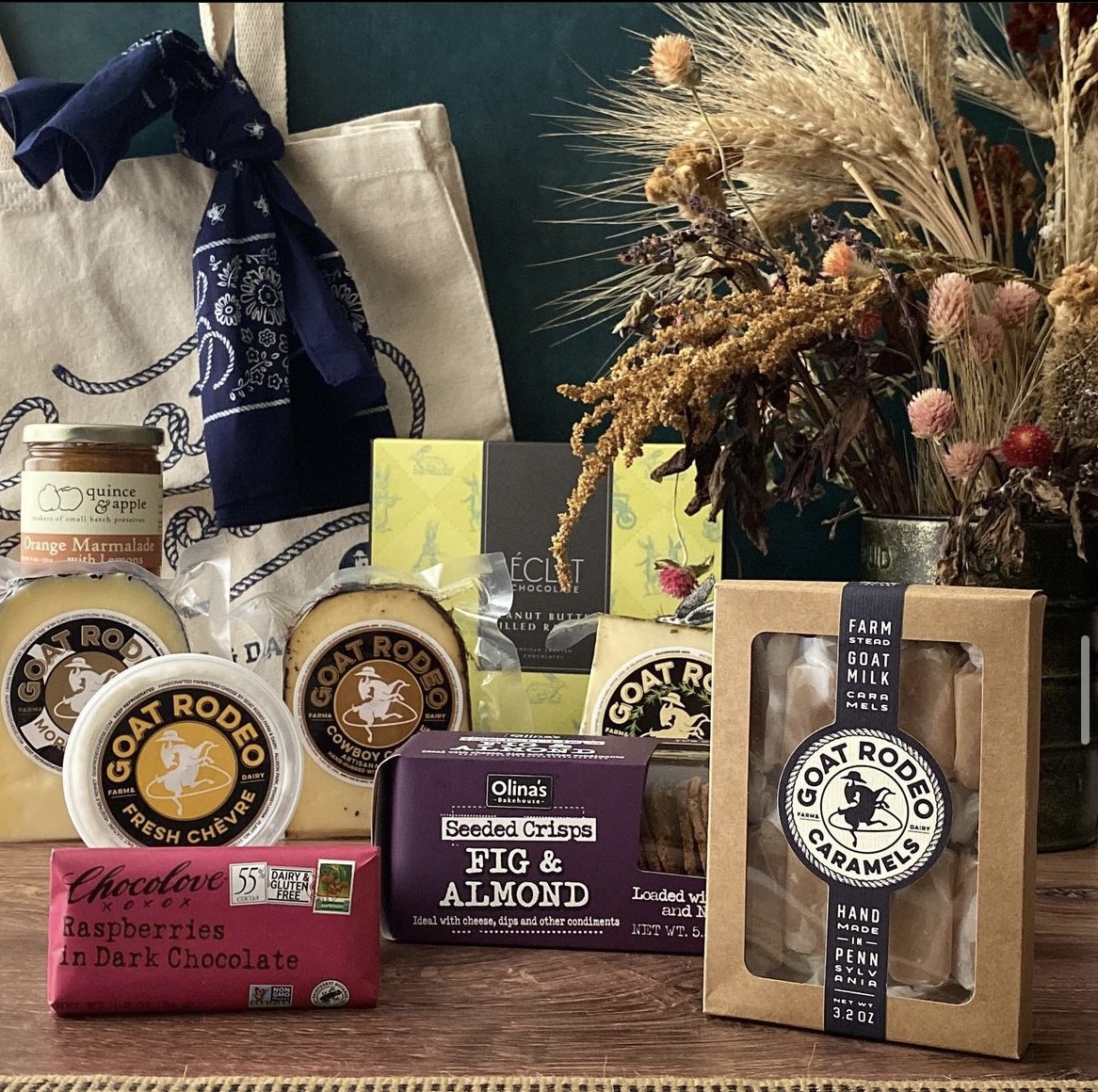 A photo of Goat Rodeo products displayed together. Different types of cheeses, sweets, and spreads are shown at this local Pittsburgh cheese shop.