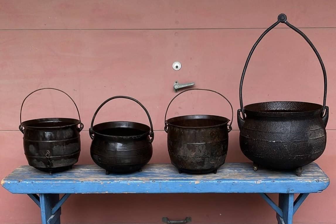 A photo of four antique cauldrons available for sale at Penhollows.