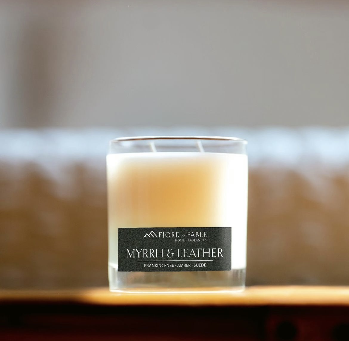 A photo of the Myrrh & Leather candle from Fjord and Fable. The scent smells like frankincense, amber, and suede.