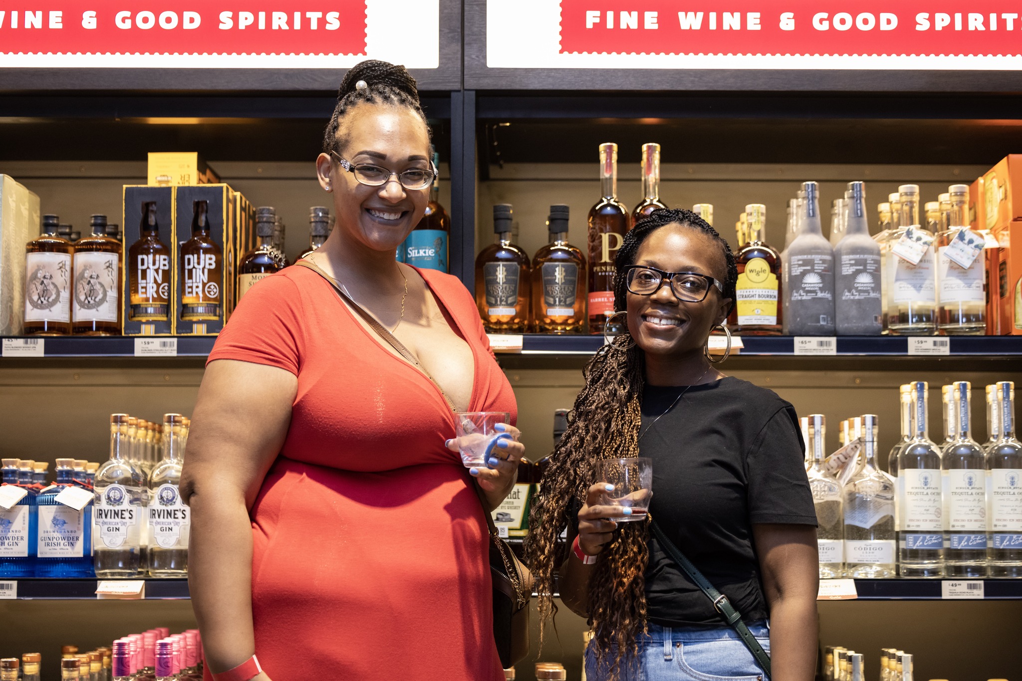 A photo of two women at the Fine Wine and Good Spirits at the Pittsburgh Wine & Spirit Festival.