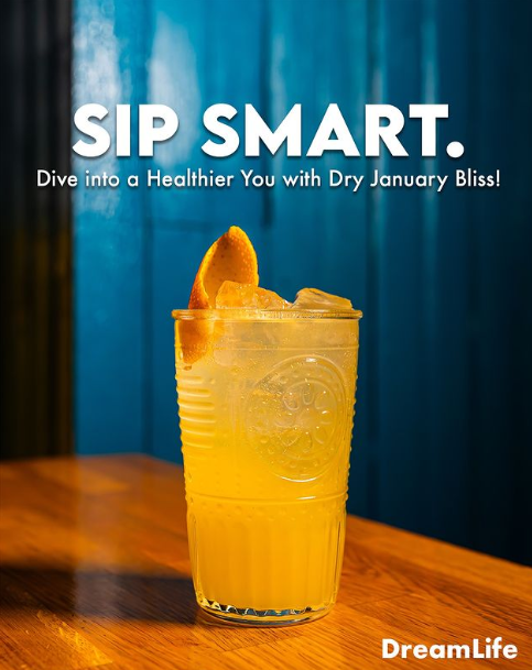 A photo of a mocktail with an orange peel in it. Text on the photo says "Sip Smart. Dive into a Healthier You with Dry January Bliss!"