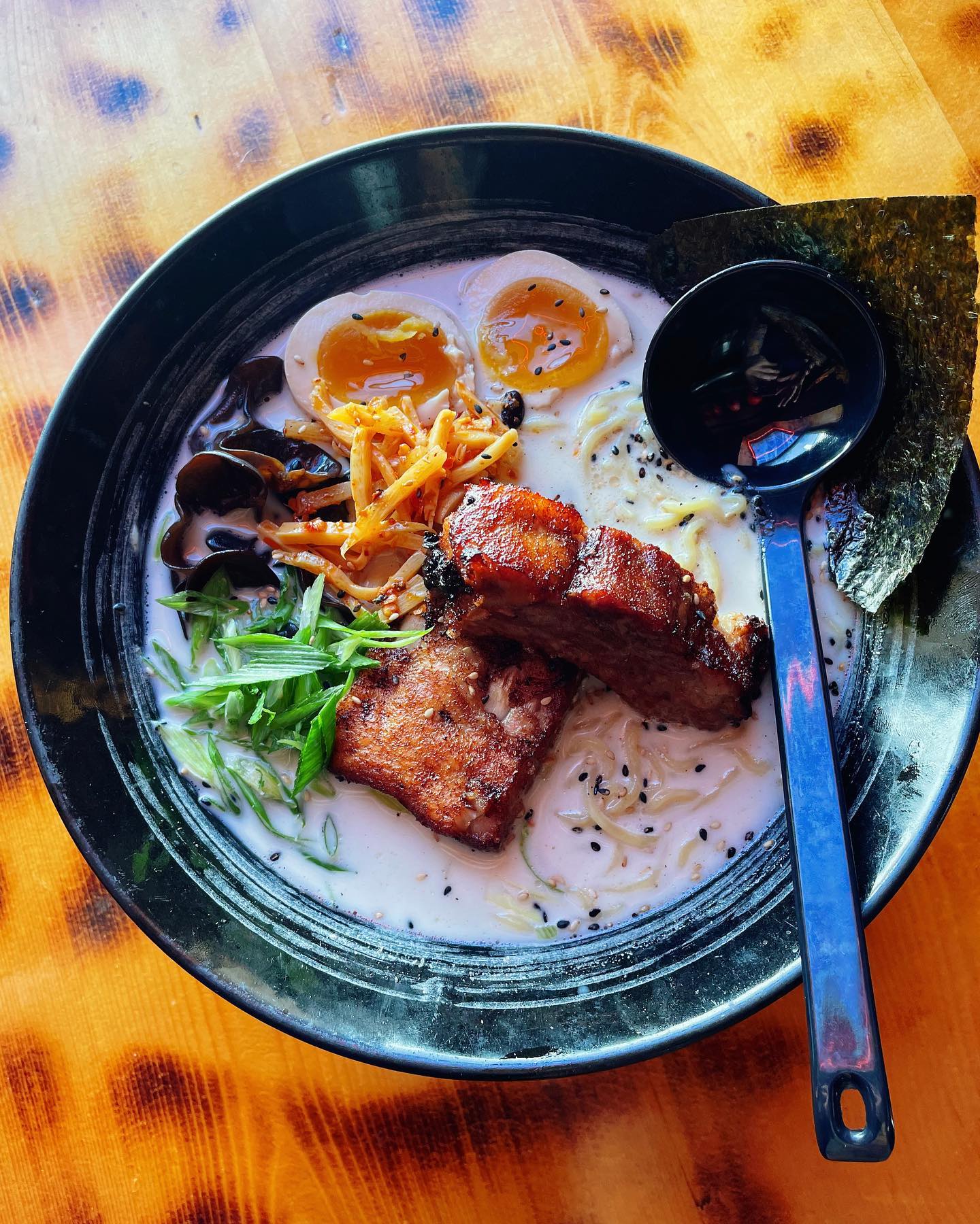 A photo of ramen with pork at UmamiPGH.