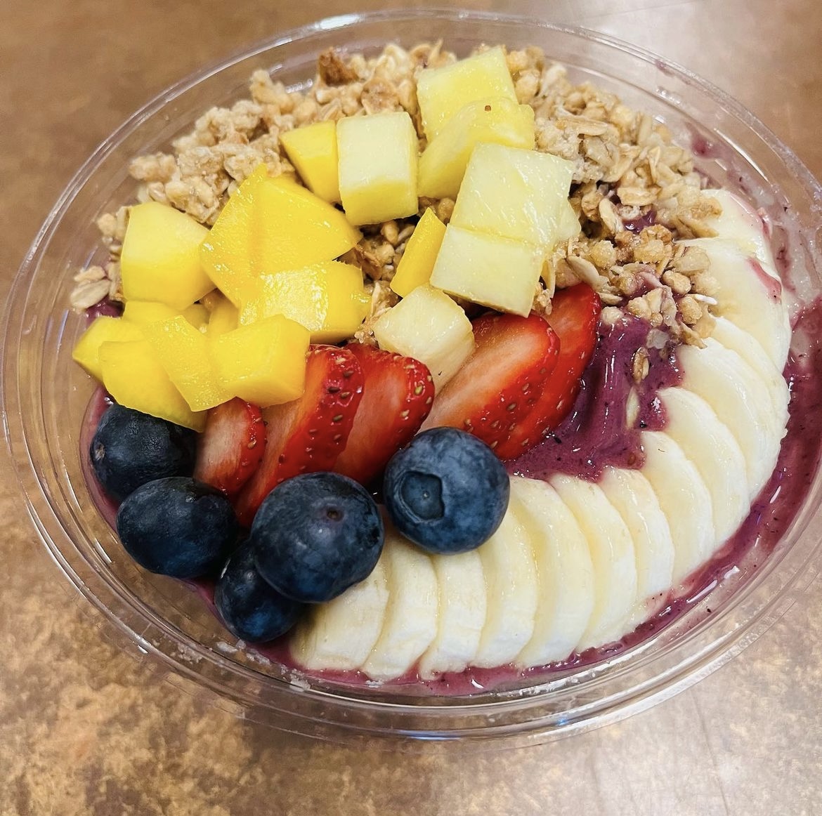 An Açaí Bowl at Uzima, which has pineapple, strawberries, blueberries, bananas, and more.