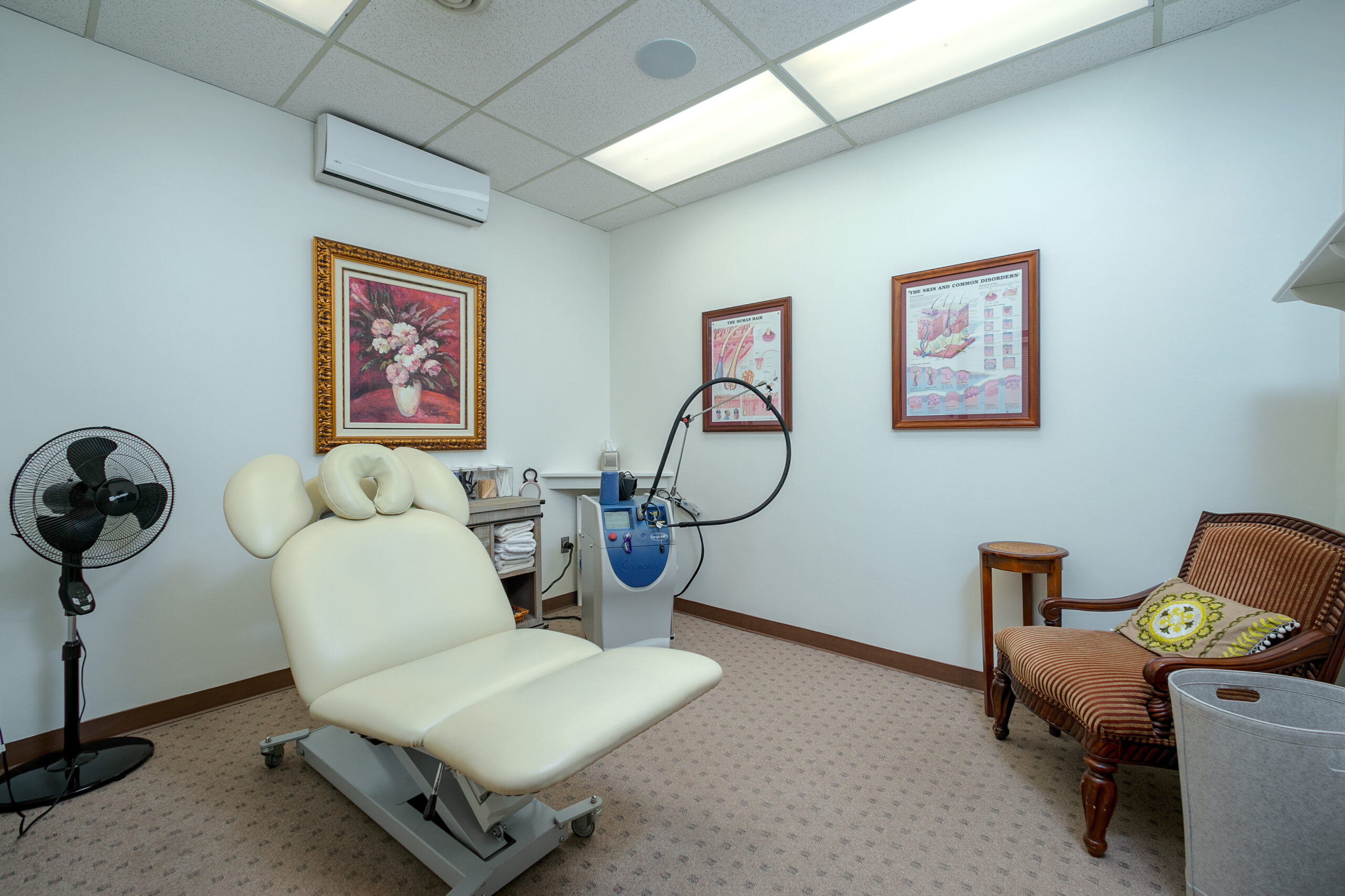 A room with chairs and equipment at Laser Hair & Skin Center of Monroeville, a med spa in Pittsburgh.