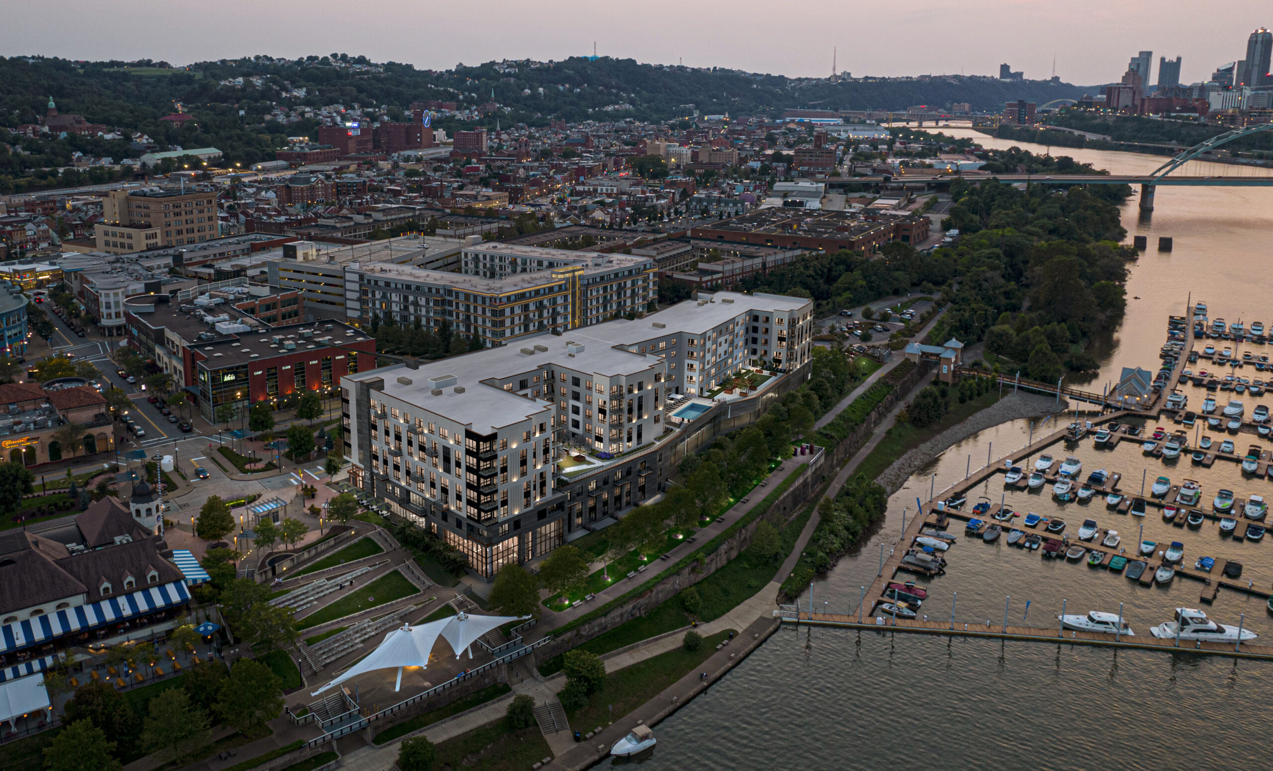 An eagle's eye view of the Park apartments at SouthSide Works along the South Shore of the river. South Side is in view on the left and downtown Pittsburgh is in the top right corner.