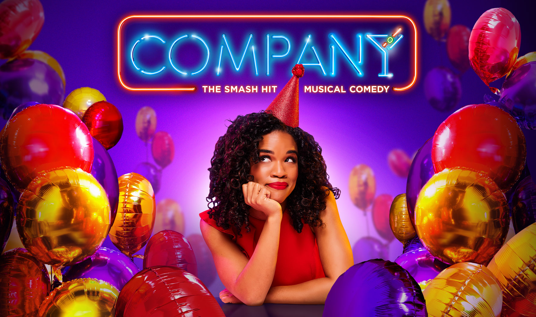 The graphic for Company. "Company" is in neon lights, with "The smash hit musical comedy" underneath the title. Bobbie, the main character, wears a red party hat and is surrounded by purple, red, and yellow balloons.