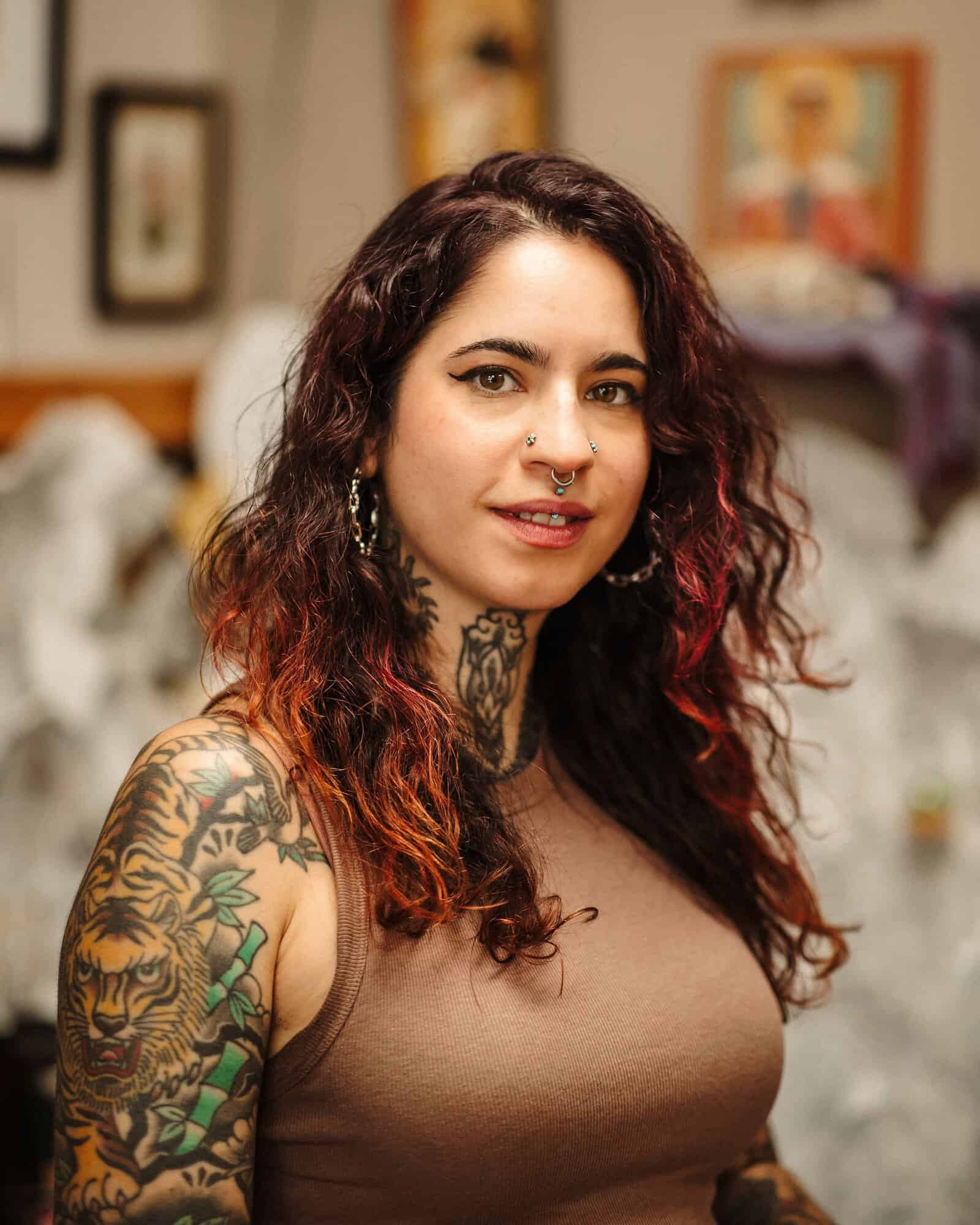 A photo of Sara Eve Rivera, tattoo artist at PMA Tattoo.