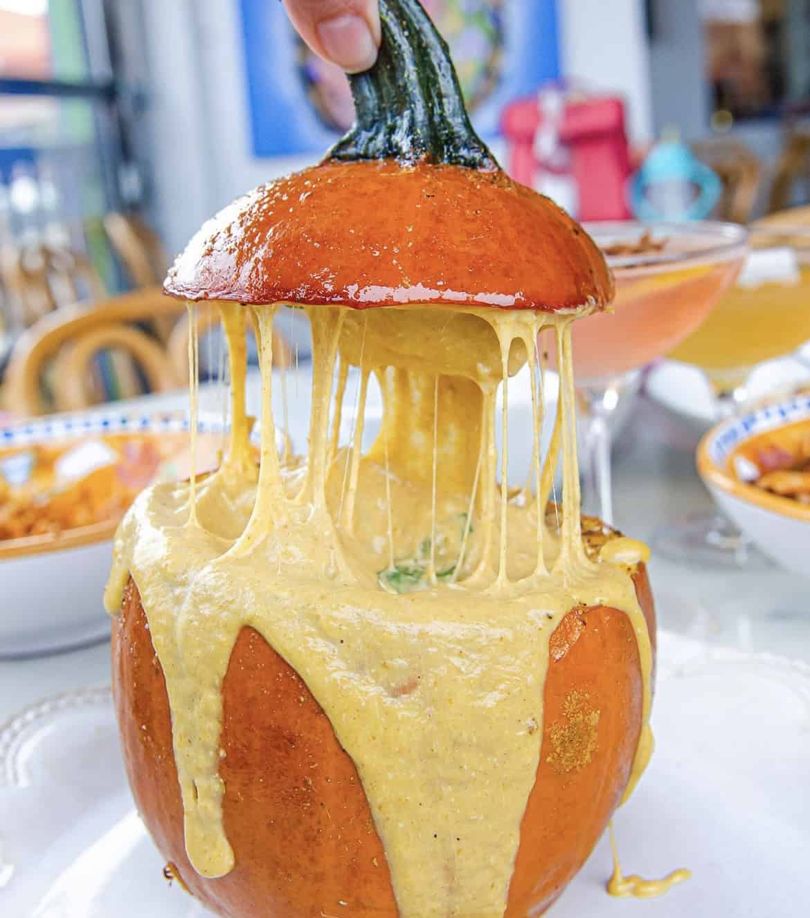 A photo of soup in a pumpkin.