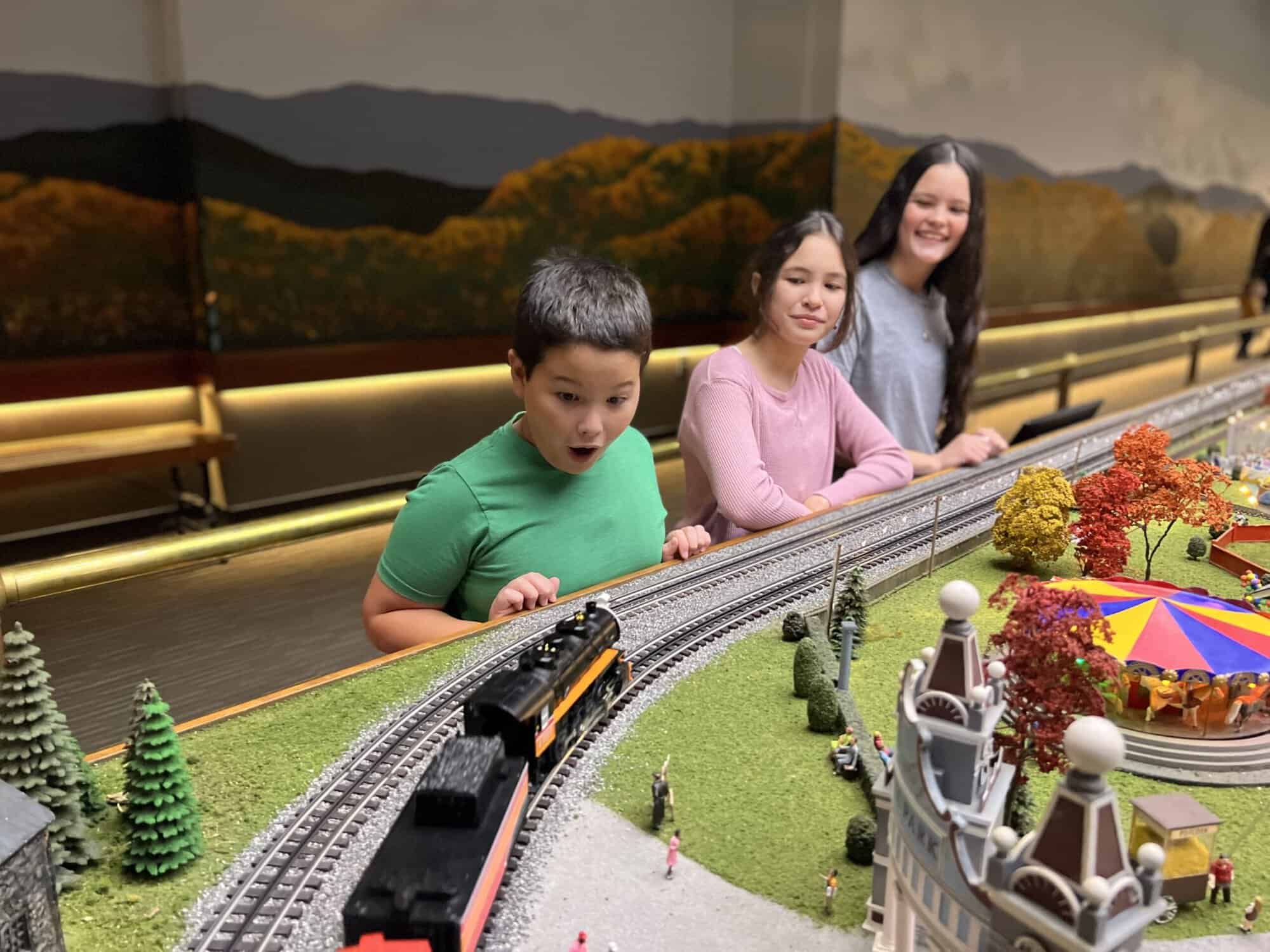 Miniature-Railroad-Village_Family-looks-at-train - Made In PGH