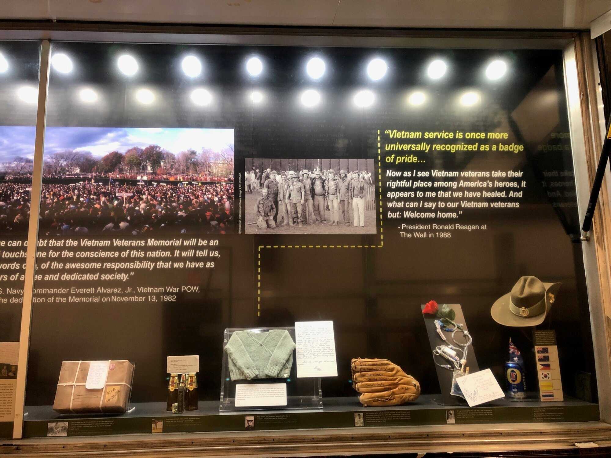 A display of items and quotes at The Wall That Heals.