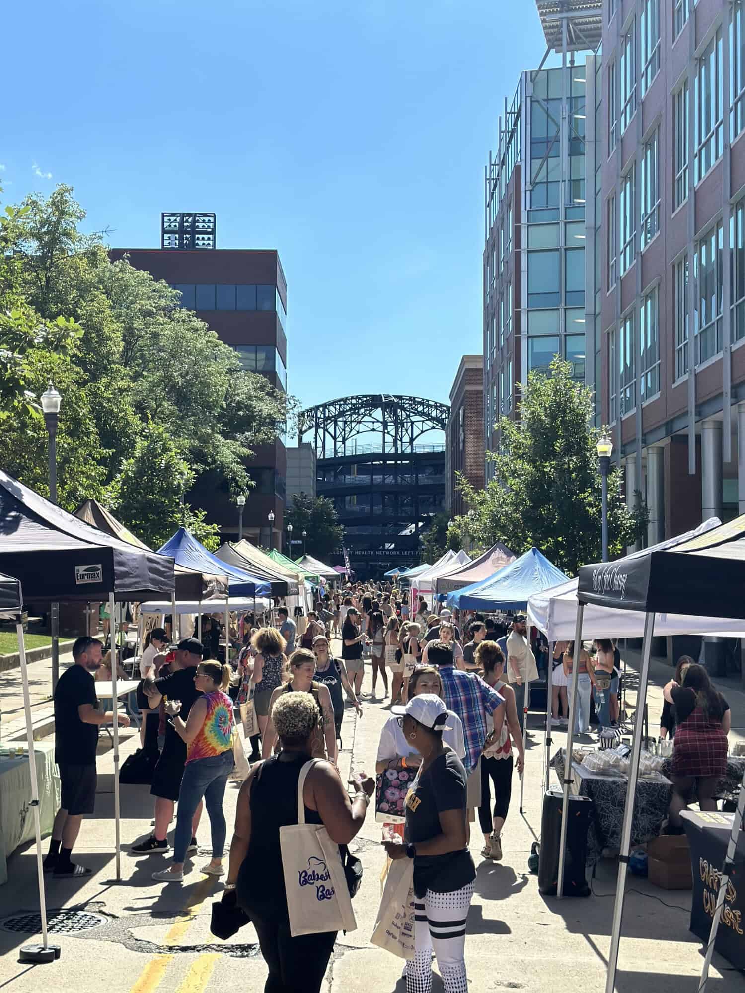A photo of vendor tents and people walking around at Babesburgh Bash on the North Shore.
