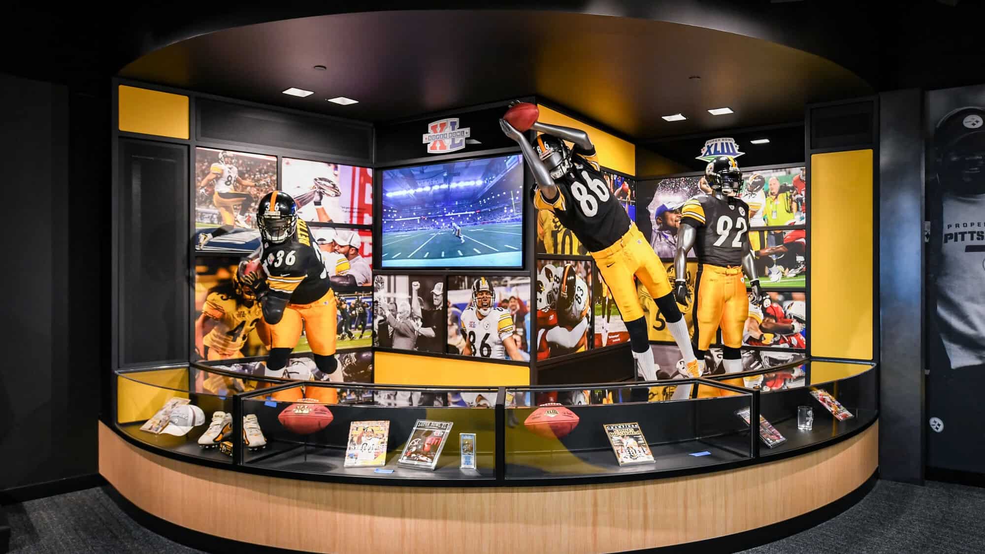 A photo of a display featuring best plays and other memorabilia. 