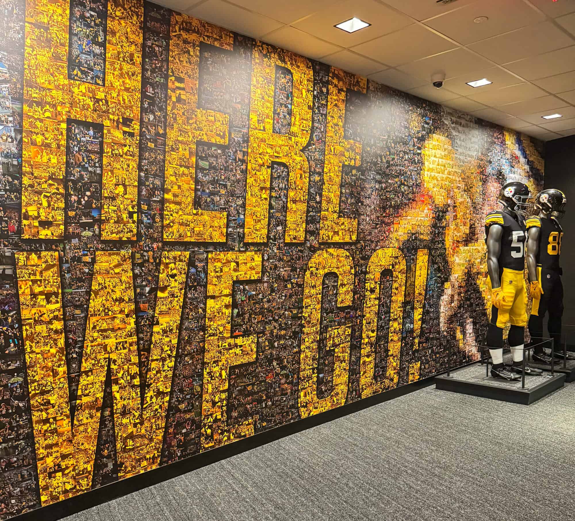 A photo of a Here We Go! wall with photos of Steelers.