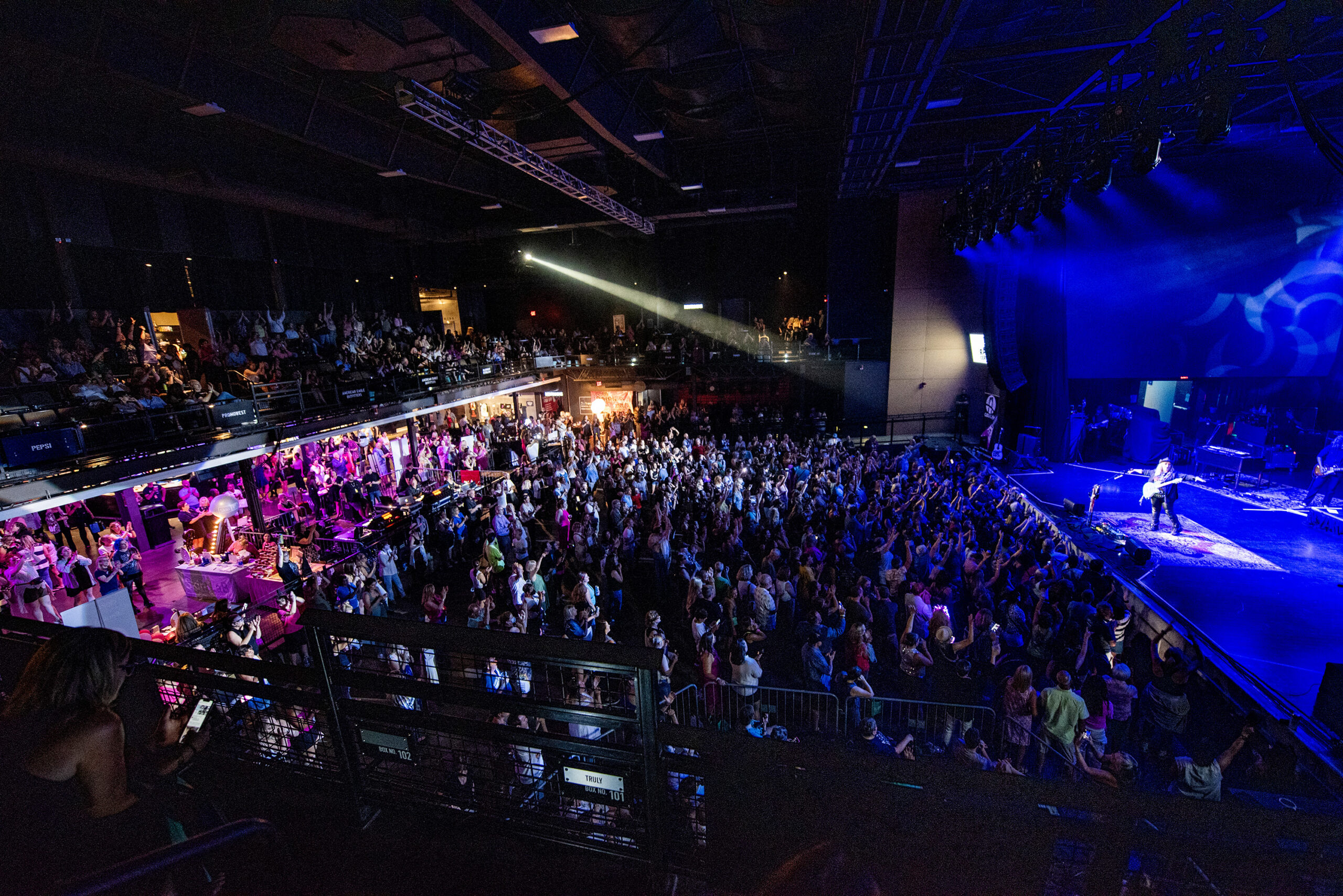 A photo of the crowd and stage at the Women Who Rock benefit concert.