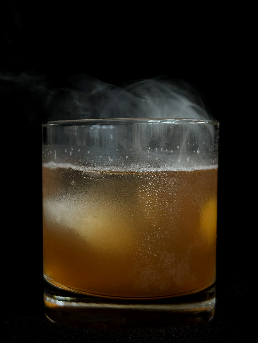 A photo of Emerson's Le Smoking cocktail in a short glass.