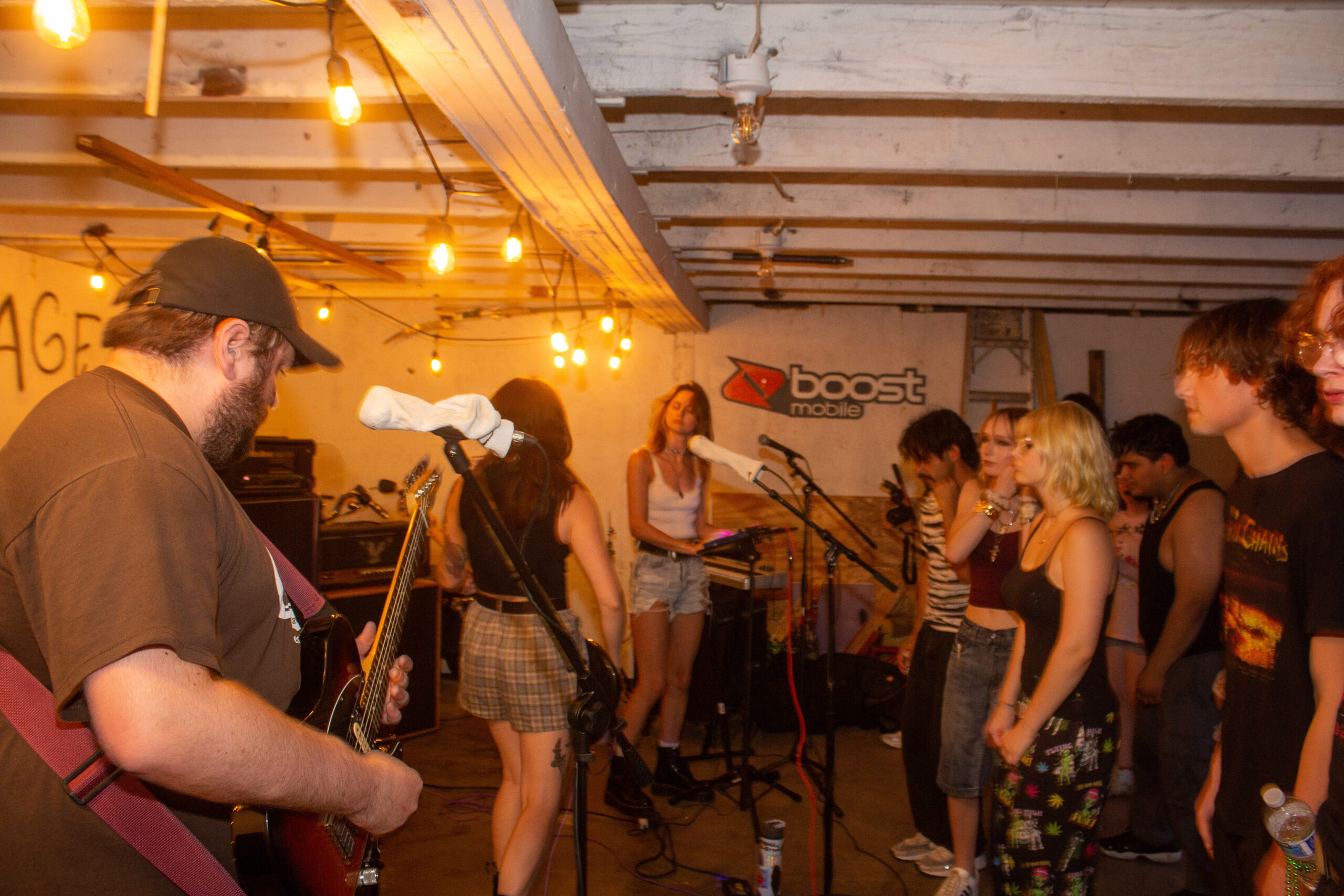 A photo of a basement show with Eyewash performing.
