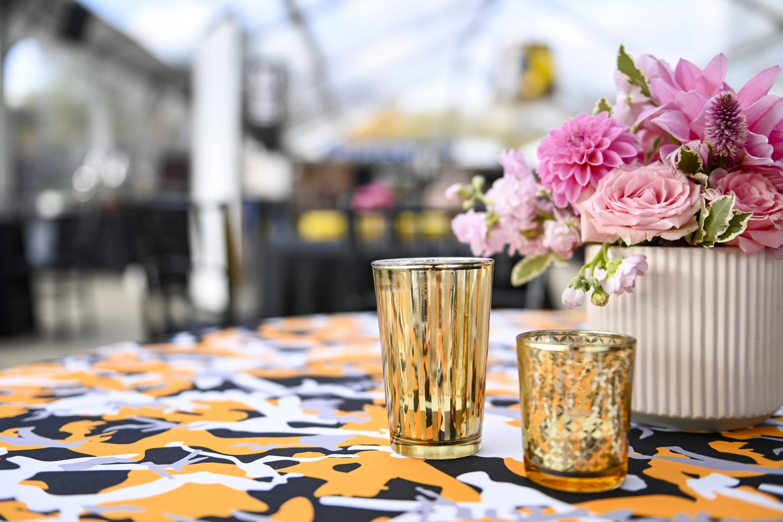 A photo of a table with flowers and candles at Steelers Style.