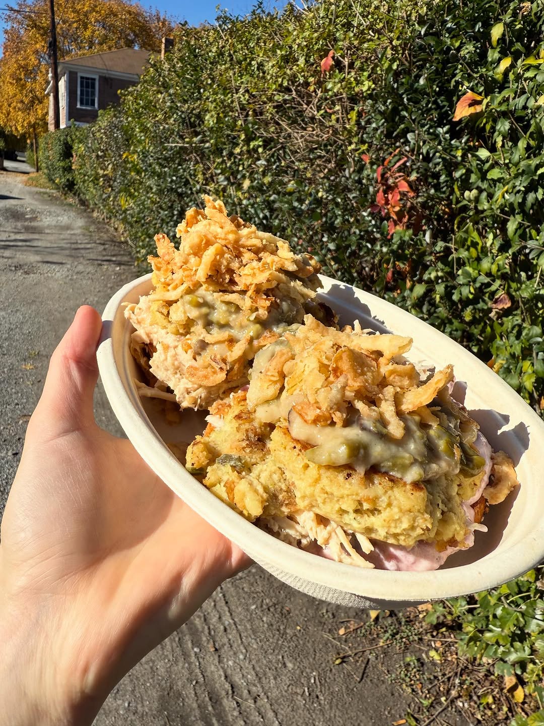 A photo of a person holding the Gobbler meal from Beaver Bagel Co.