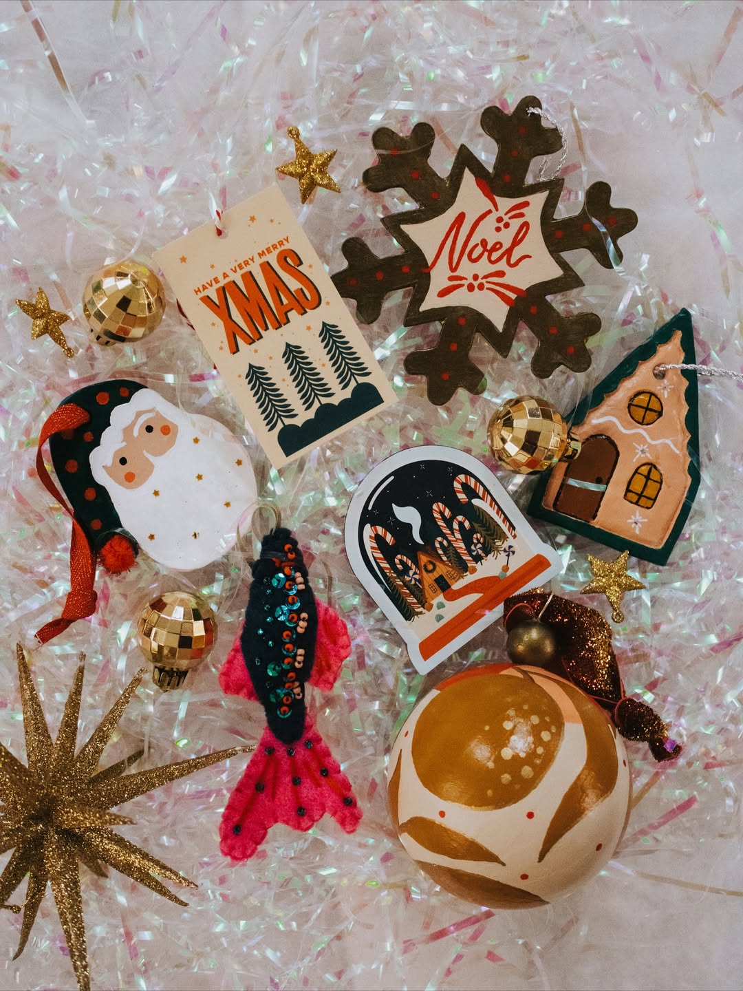 A photo of holiday ornaments and cards by Lindsay Hill Studio.